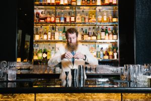 Thomas Waugh tends the bar at The Pool Room Lounge, NYC