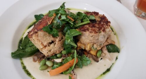 Griddle Seared Gulf Fishcakes, smoked redfish over Louisiana soybeans, local mushrooms, roasted squash and truffled cauliflower cream.